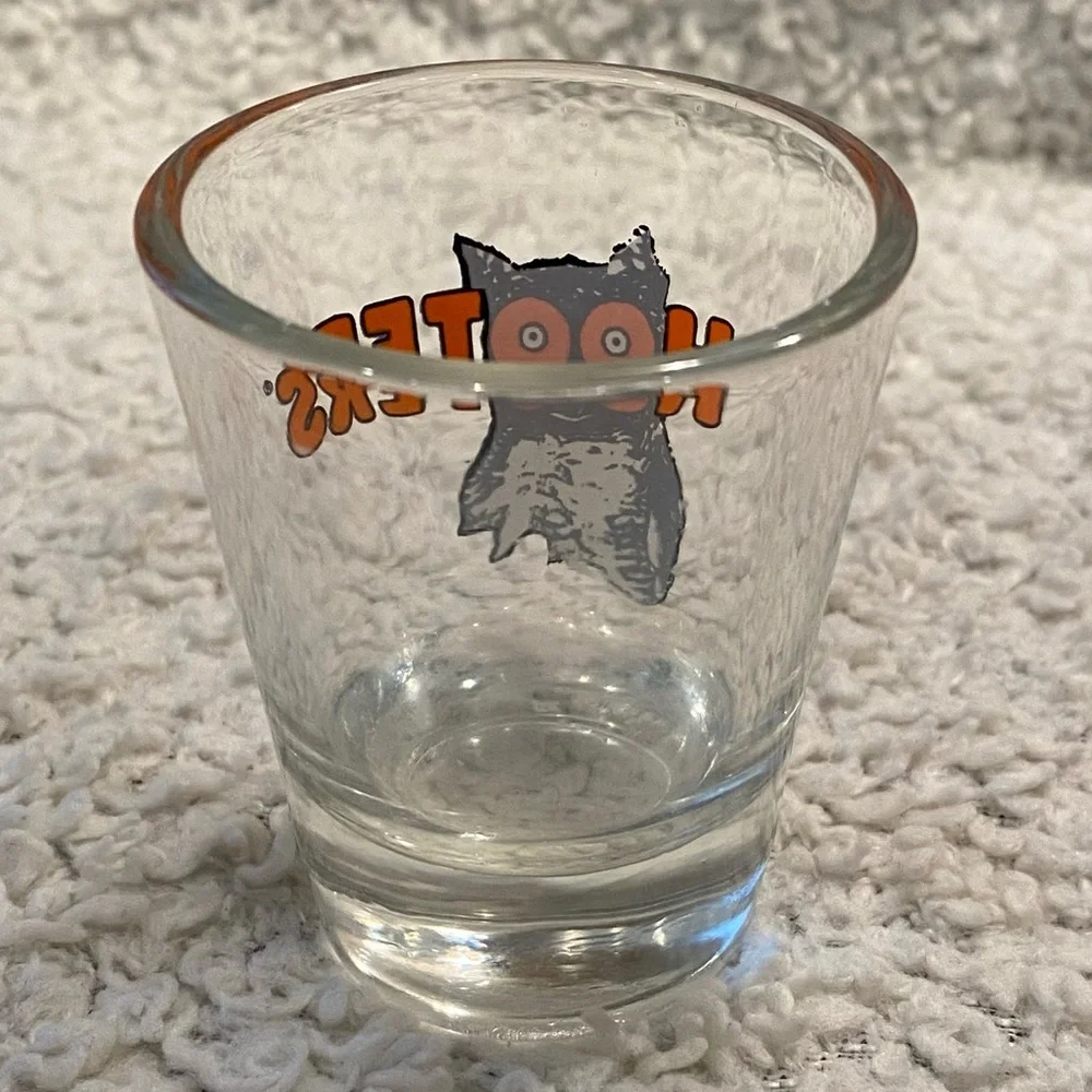 Hooter’s shot glass,  white orange with owl logo, no city specified